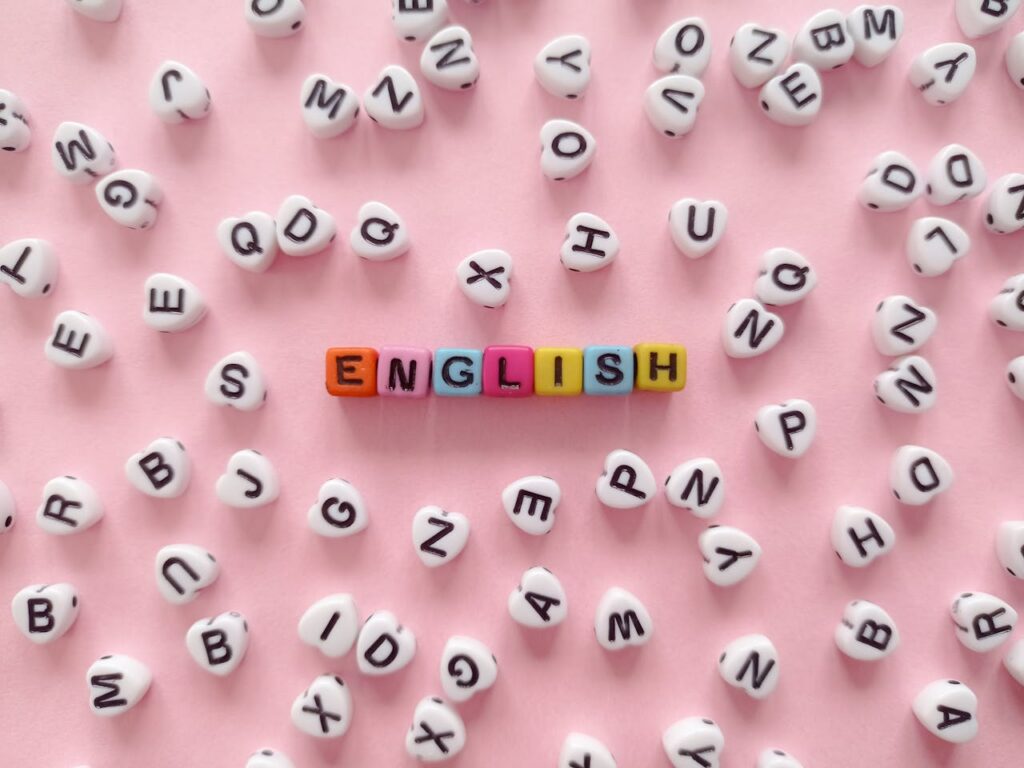 Scattered letter beads form the word 